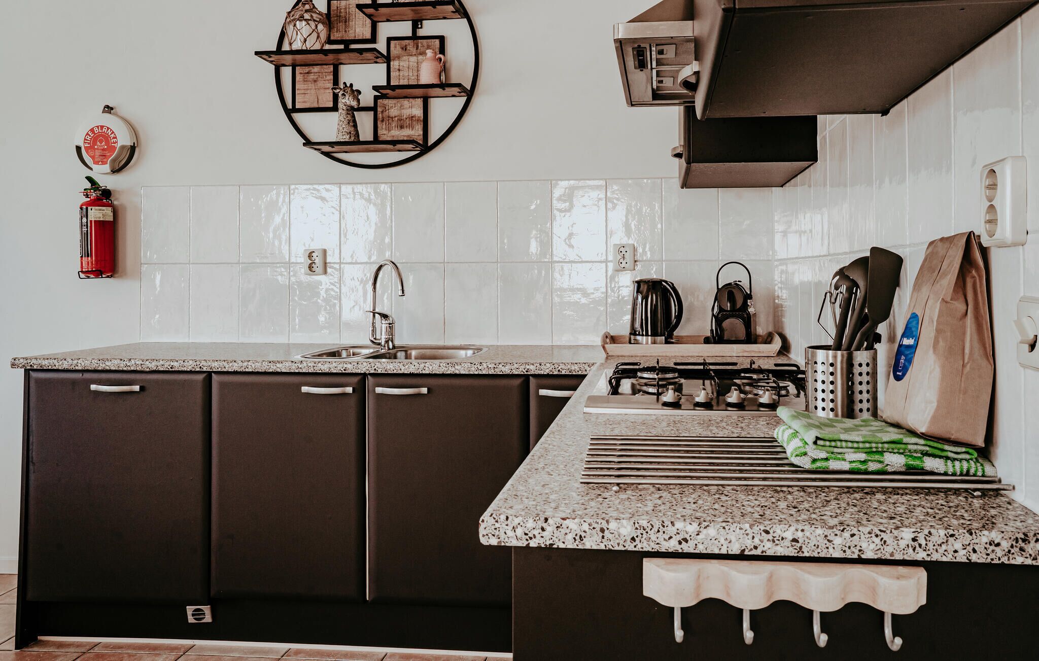 Fridge, stovetop, dishwasher, coffee/tea maker