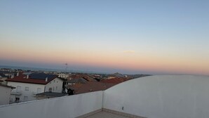 A residential area with multiple buildings, a clear sky, and a distant view of the sea. - B&B San Salvo (San Salvo)