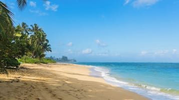 On the beach, sun loungers, beach towels