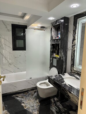 Bidet, towels, soap, shampoo