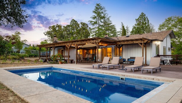 A poolside area with a pool, lounge chairs, and a covered patio. - Russian River Wine Country Retreat Near Healdsburg: Pool, AC & EV Charger (Forestville)