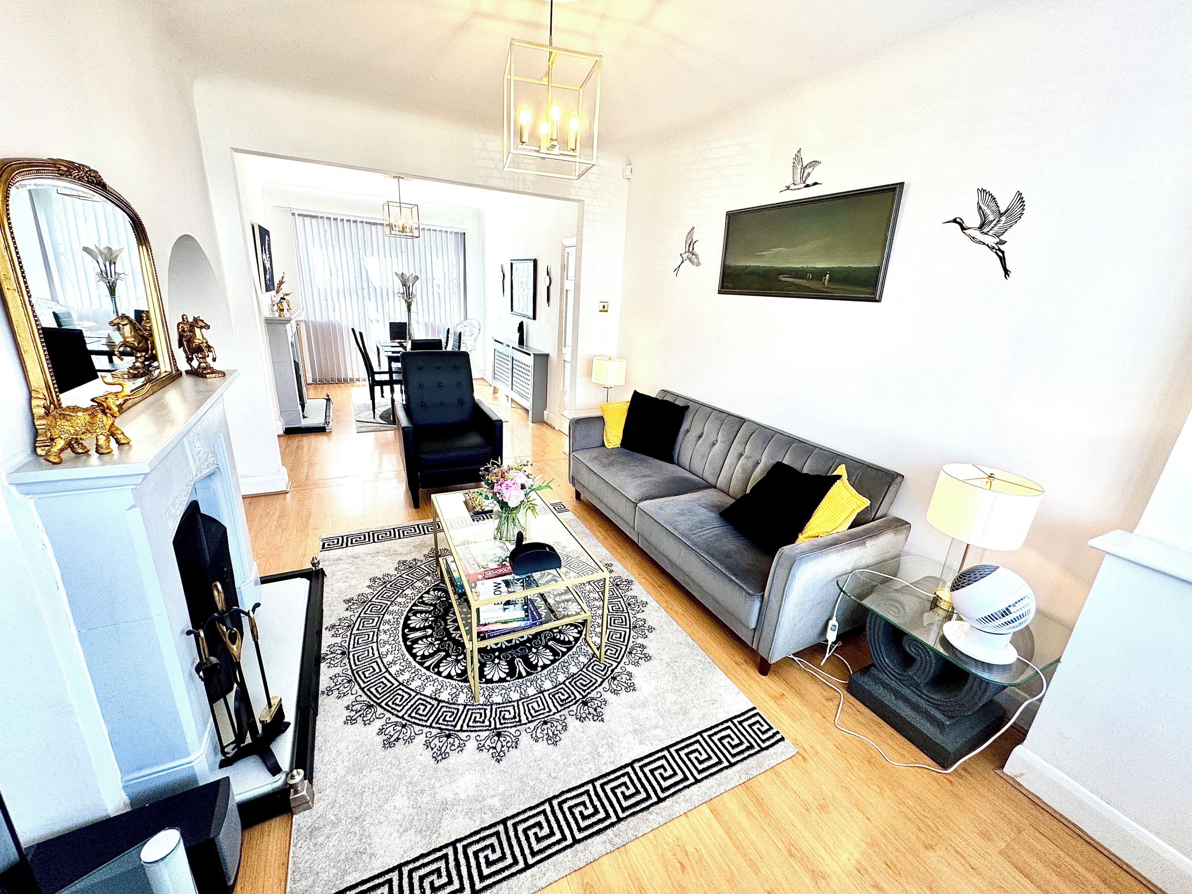 Smart TV, fireplace, books, printers