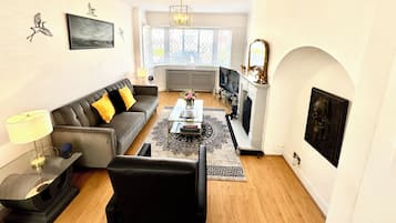 Smart TV, fireplace, books, printers