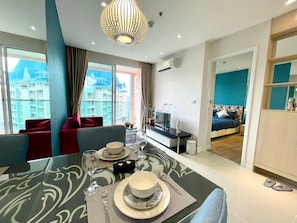 Basic Apartment, Pool View | Living area - Grande Carribean Condo By Thita (Pattaya)