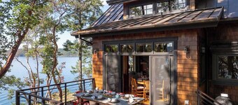 Magnificent waterfront home where sustainability meets luxury. Five private wooded acres, 400ft of rocky bluff shoreline, Chef's Kitchen, Stone Fireplaces, Heated Tile Floors & Unforgettable Sunsets over Wasp Passage. Your perfect PNW escape awaits.