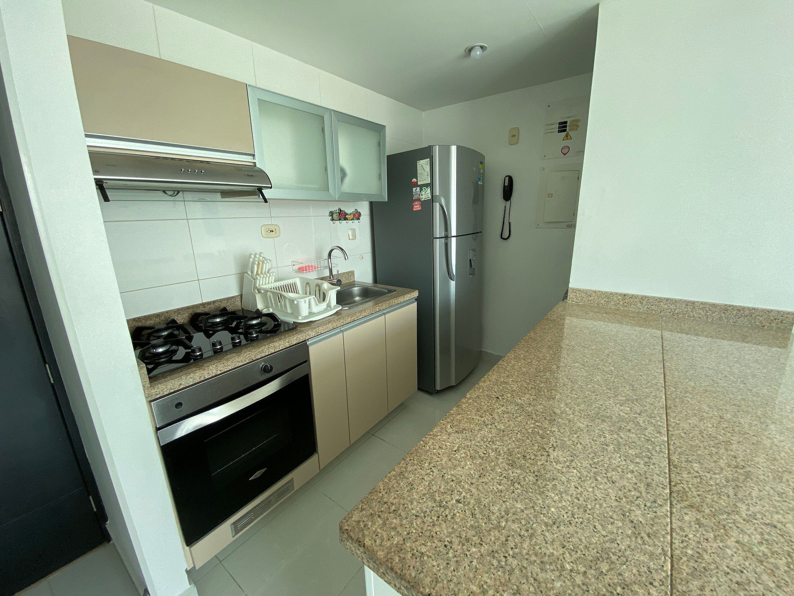 Apartment | Private kitchen | Full-size fridge, microwave, cookware/dishes/utensils