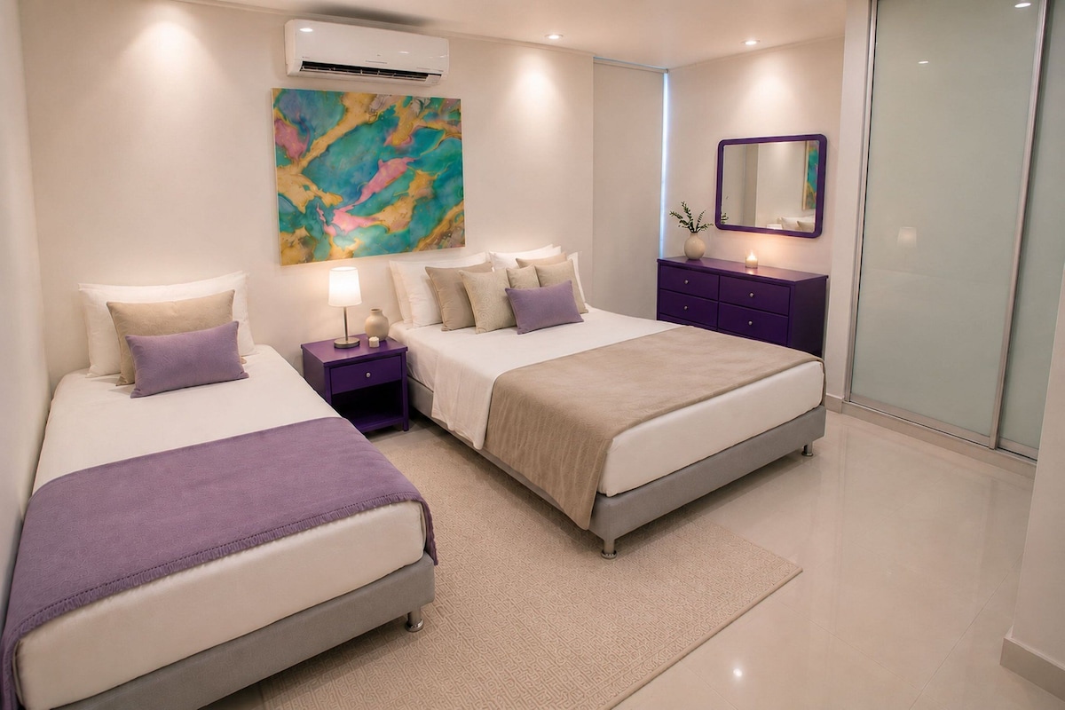 A modern bedroom with two beds, a nightstand, a dresser, a mirror, and an air conditioning unit.