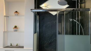 Shower, hair dryer, towels, soap