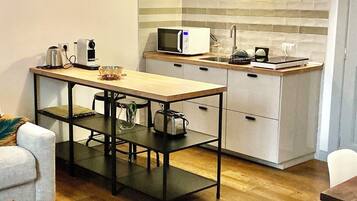 Fridge, microwave, stovetop, coffee/tea maker