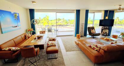 Gorgeous Eagle Beach 4-bedroom Condo with surround balcony and fitness room