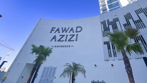 A building with the sign 'FAWAD AZIZI RESIDENCE' indicating a residential property. - Luxurious 1-br Apt With Balcony in Azizi Fawad (Dubai)