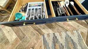 A kitchen drawer with utensils and cookware. - Modern Boho- 4/3-King Beds/Pool! Pet friendly! (Tampa)