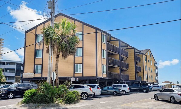Stylish residential building with a flat roof and balconies.