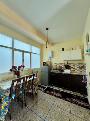 Fridge, coffee/tea maker, cookware/dishes/utensils