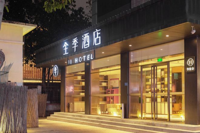 A hotel entrance with a sign reading 'Full Moon Hotel.'