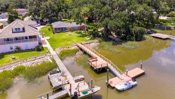 A residential area with houses, a dock, and a small boat.