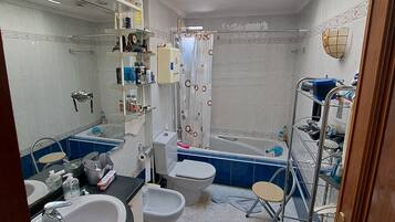 Bidet, towels, toilet paper