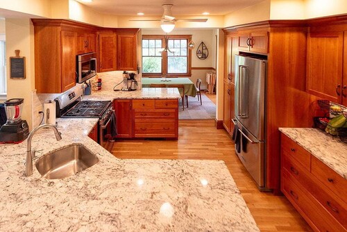 Charming, sunny 4-bedroom home with wooded yard in family-friendly Newton