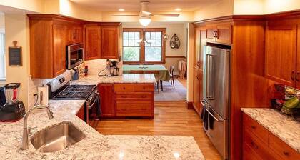 Charming, sunny 4-bedroom home with wooded yard in family-friendly Newton