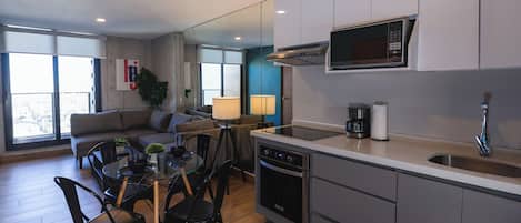 Fridge, microwave, coffee/tea maker, cookware/dishes/utensils