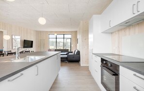 Fridge, stovetop, dishwasher, coffee/tea maker
