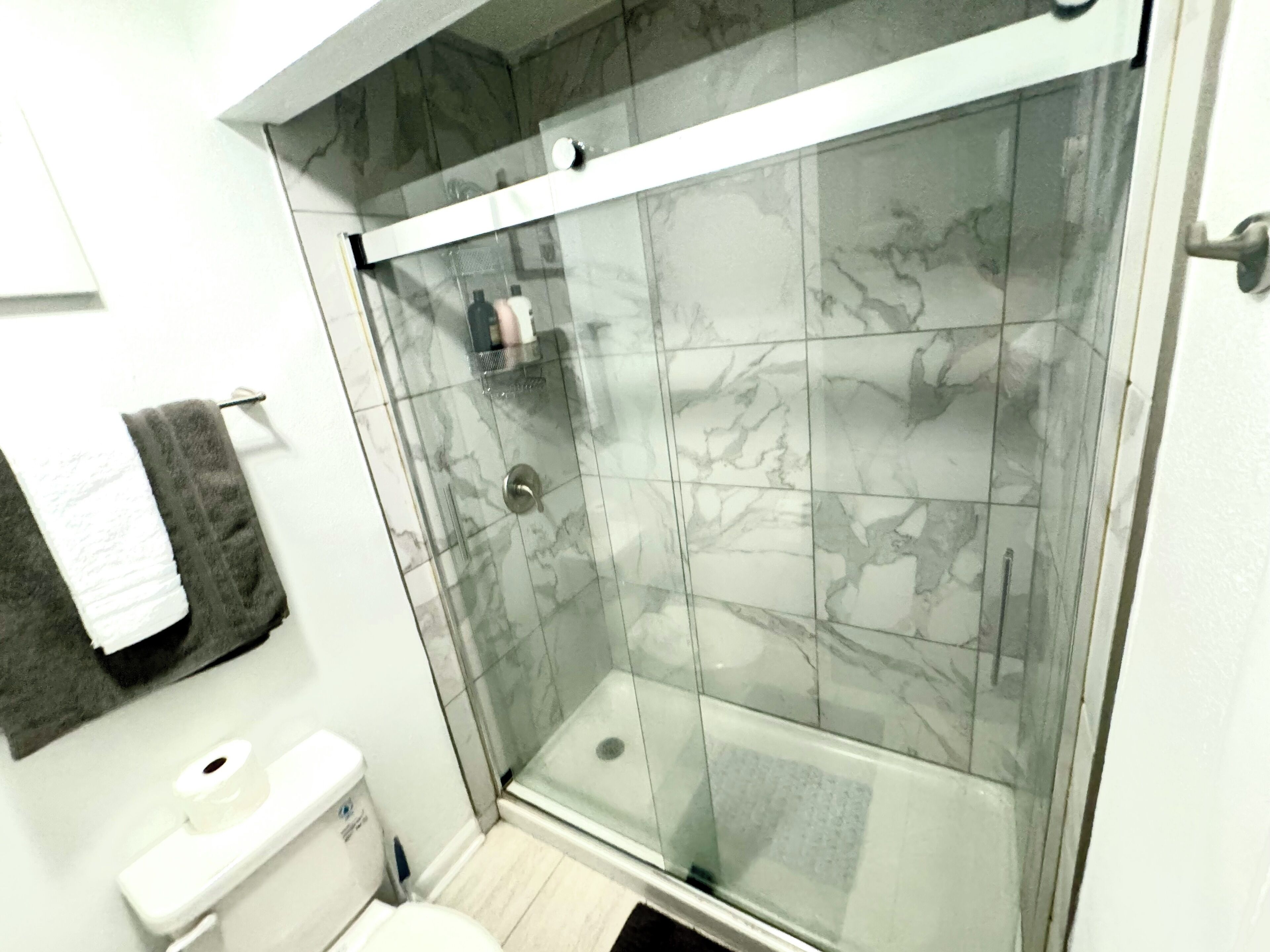 Shower, hair dryer, towels, soap