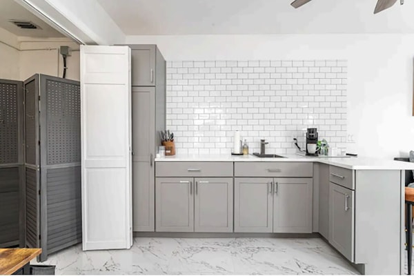 Fridge, microwave, coffee/tea maker, cookware/dishes/utensils