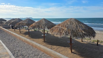 On the beach, sun loungers, beach towels