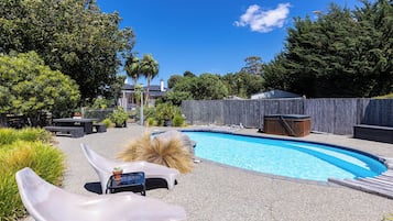 Seasonal outdoor pool, open 6:00 AM to 10:00 PM, pool umbrellas