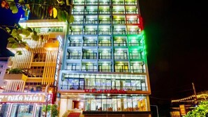 A multi-story hotel with a modern facade, balconies, and a visible entrance. - UFJ Hotel SS - by Bay Luxury (Sam Son)