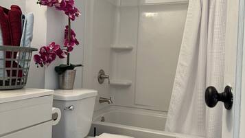 Hair dryer, towels, soap, shampoo