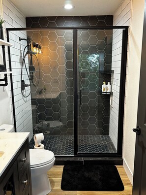 Shower, hair dryer, towels, soap