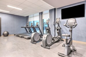 A gym with treadmills, elliptical machines, and a stationary bike. - Staybridge Suites Port Arthur Mall Area (Port Arthur)