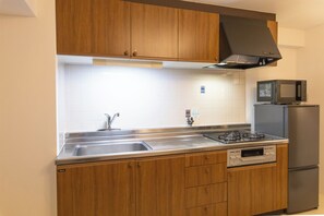Deluxe Apartment | Private kitchen | Full-size fridge, microwave, stovetop, toaster - Dotonbori East Residence Haru (Osaka)