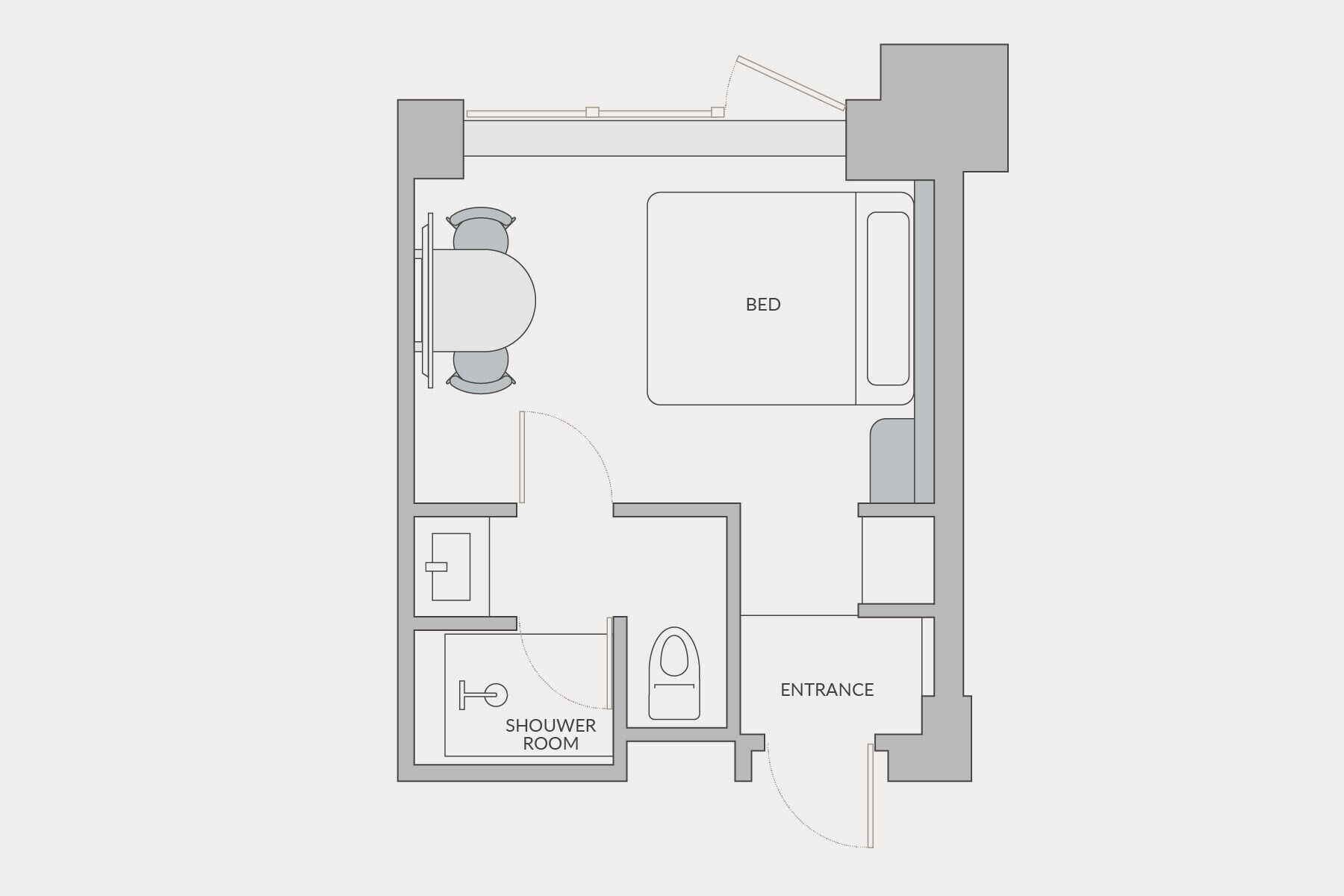 A floor plan with a bedroom, bathroom, and shower room.