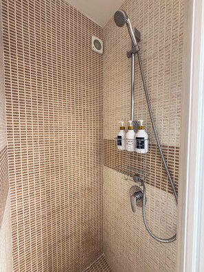 Shower, hair dryer, towels, soap