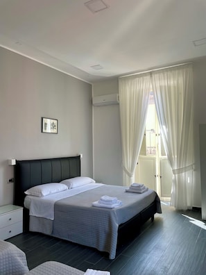 Family Quadruple Room, Balcony, City View | Down comforters, free cribs/infant beds, travel crib, free WiFi