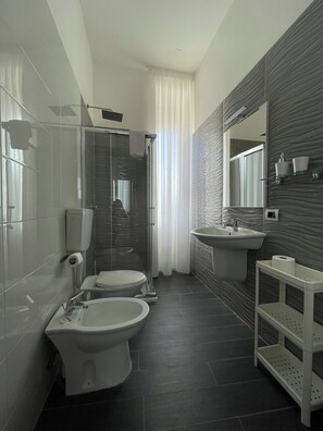 Standard Double Room, City View | Bathroom | Shower, rainfall showerhead, free toiletries, hair dryer