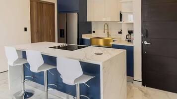 Fridge, microwave, stovetop, coffee/tea maker