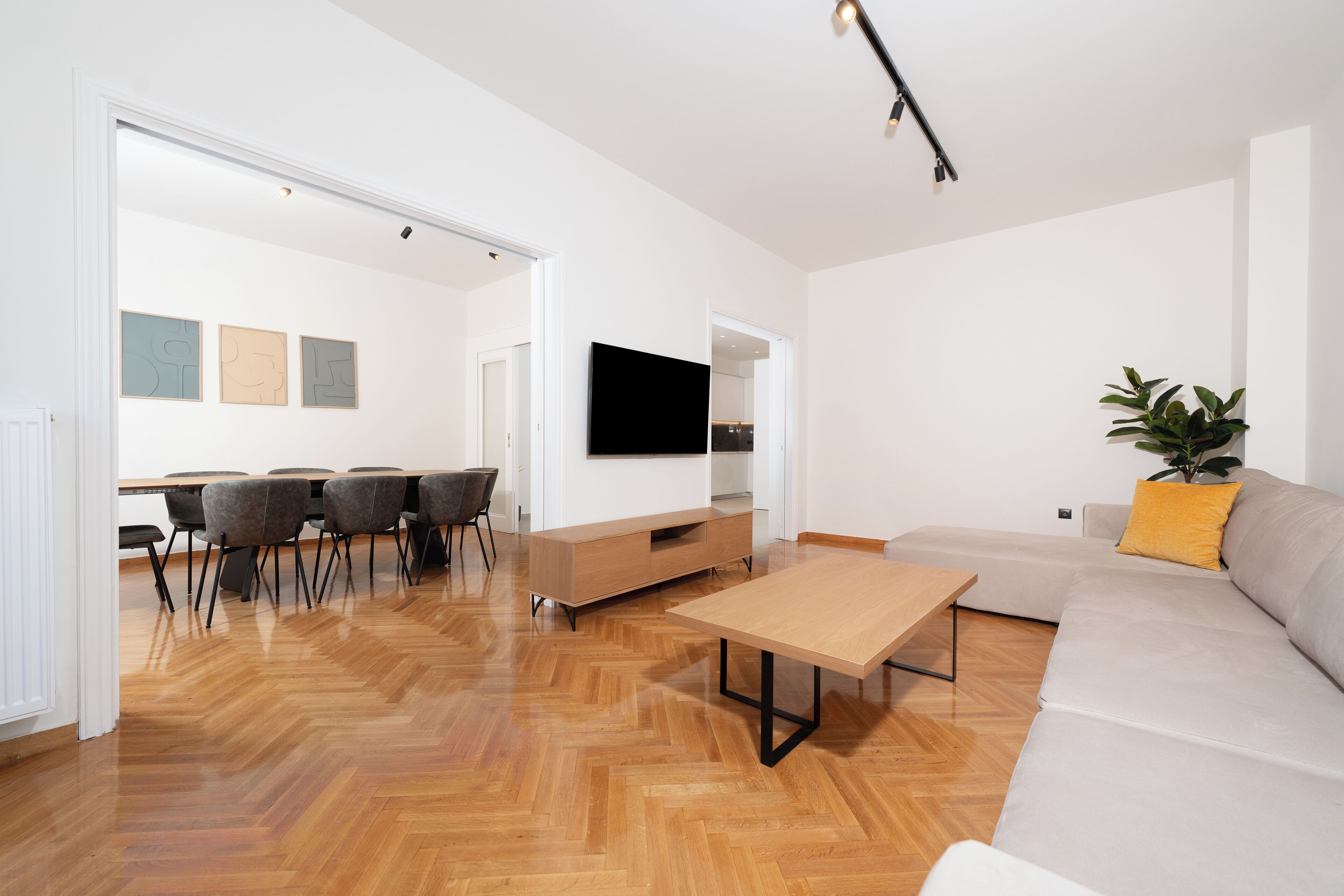 Deluxe Apartment, 3 Bedrooms, Balcony, City View | Living room | 50-inch TV with cable channels