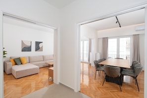 Deluxe Apartment, 3 Bedrooms, Balcony, City View | Living area | 50-inch TV with cable channels - Kolonaki Elegant Apartment with Balcony (Athens)