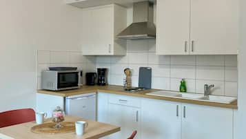 Exclusieve studio suite | Privékeuken | Een kinderstoel
