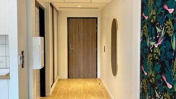 Suite estudio exclusiva | Área de sala de estar | Televisión