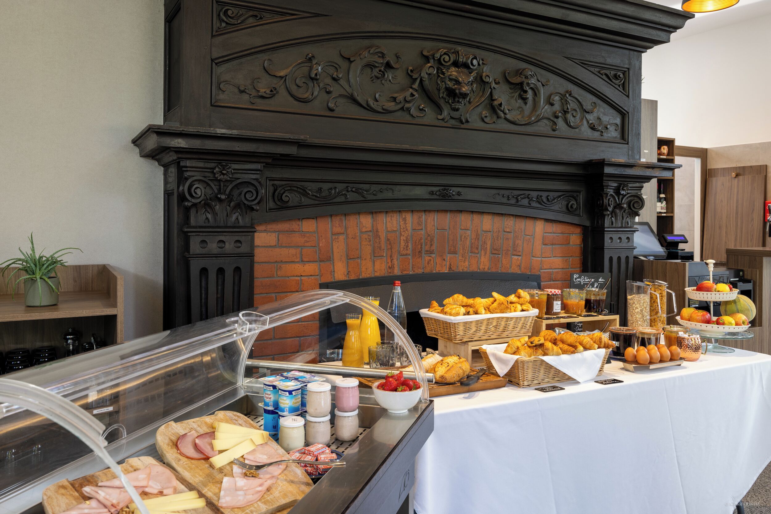 A breakfast buffet with various food items and beverages.