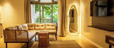 Family Studio Suite, Balcony, Garden View | Living area | Flat-screen TV