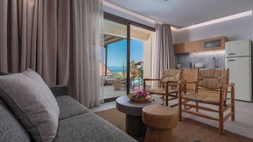 Elegant Suite Sea View | Living area | 50-inch flat-screen TV with cable channels