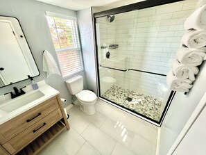 Shower, hair dryer, towels, soap