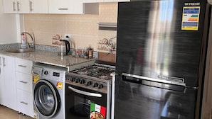 Apartment | Private kitchen | Fridge, microwave, oven, stovetop