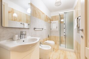 Shower, eco-friendly toiletries, hair dryer, bidet