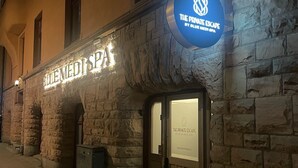 A stone building with a sign for 'BlueMed Spa' and 'The Private Escape by BlueMed Spa'. - The Private Escape by Blue Medi Spa (Stockholm)
